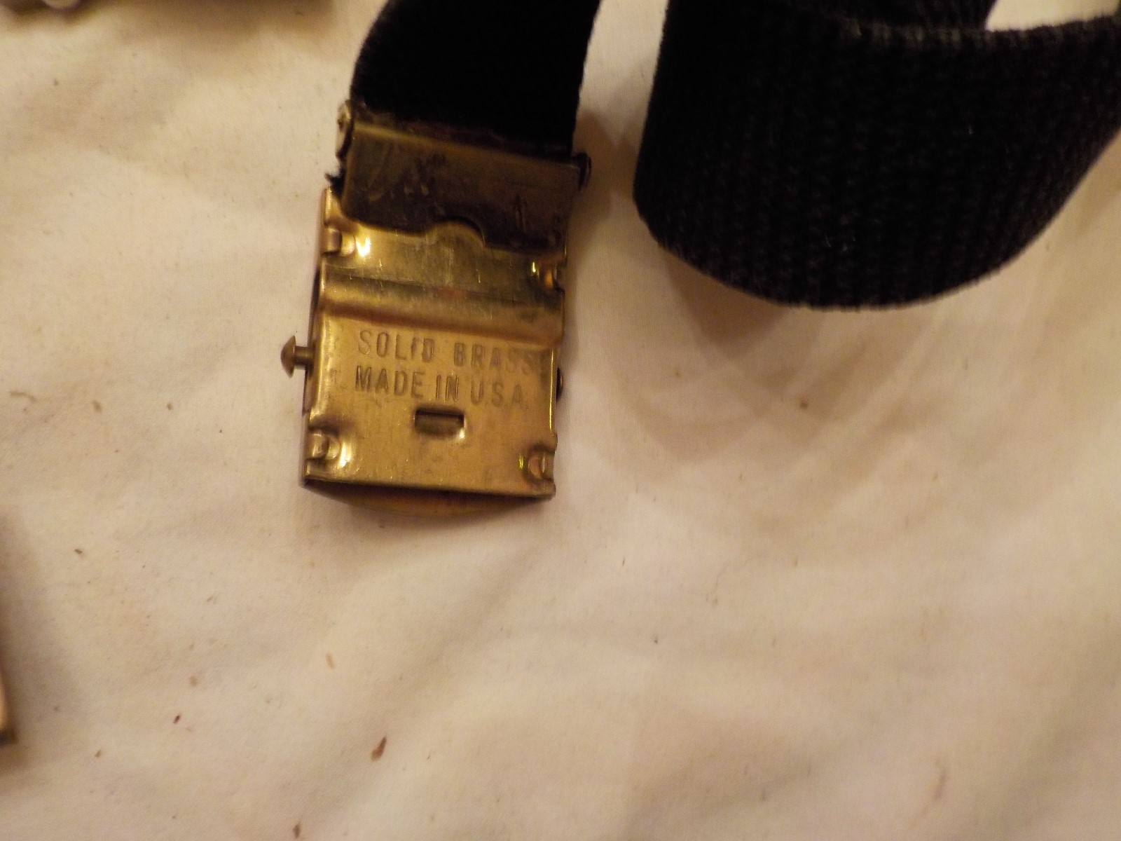 LOT OF ASSORTED MILITARY BELT BUCKLES AND  ONE BELT