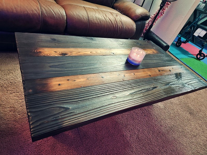 Homemade coffee table with japenese influenced burning, metal legs, lightweight.