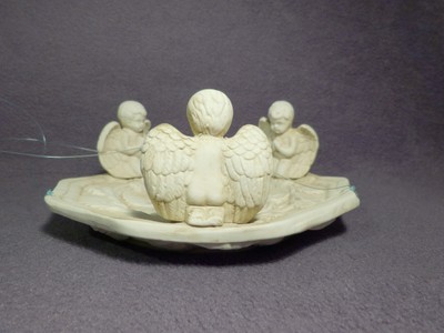 Hanging ceramic dish with cherubs, 8 1/2
