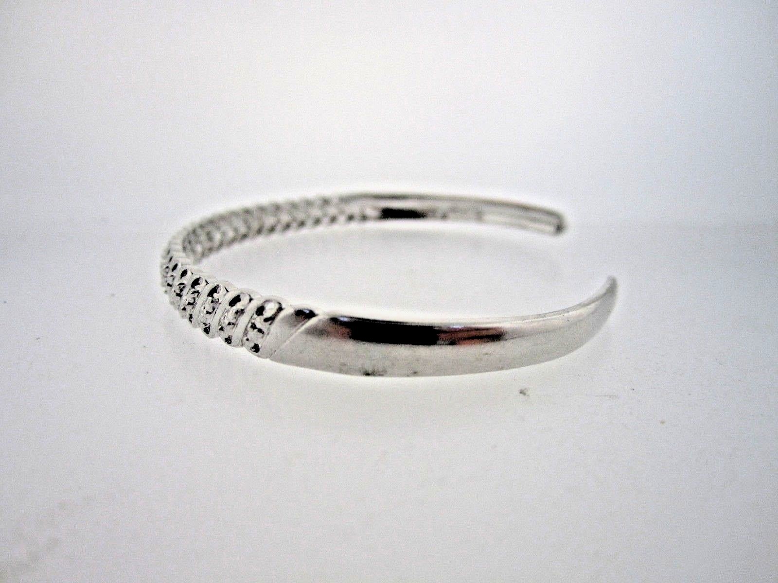 * .925 STERLING SILVER BANGLE  WITH 1 POINT DIAMOND AND LOOK OF DIAS THROUGHOUT
