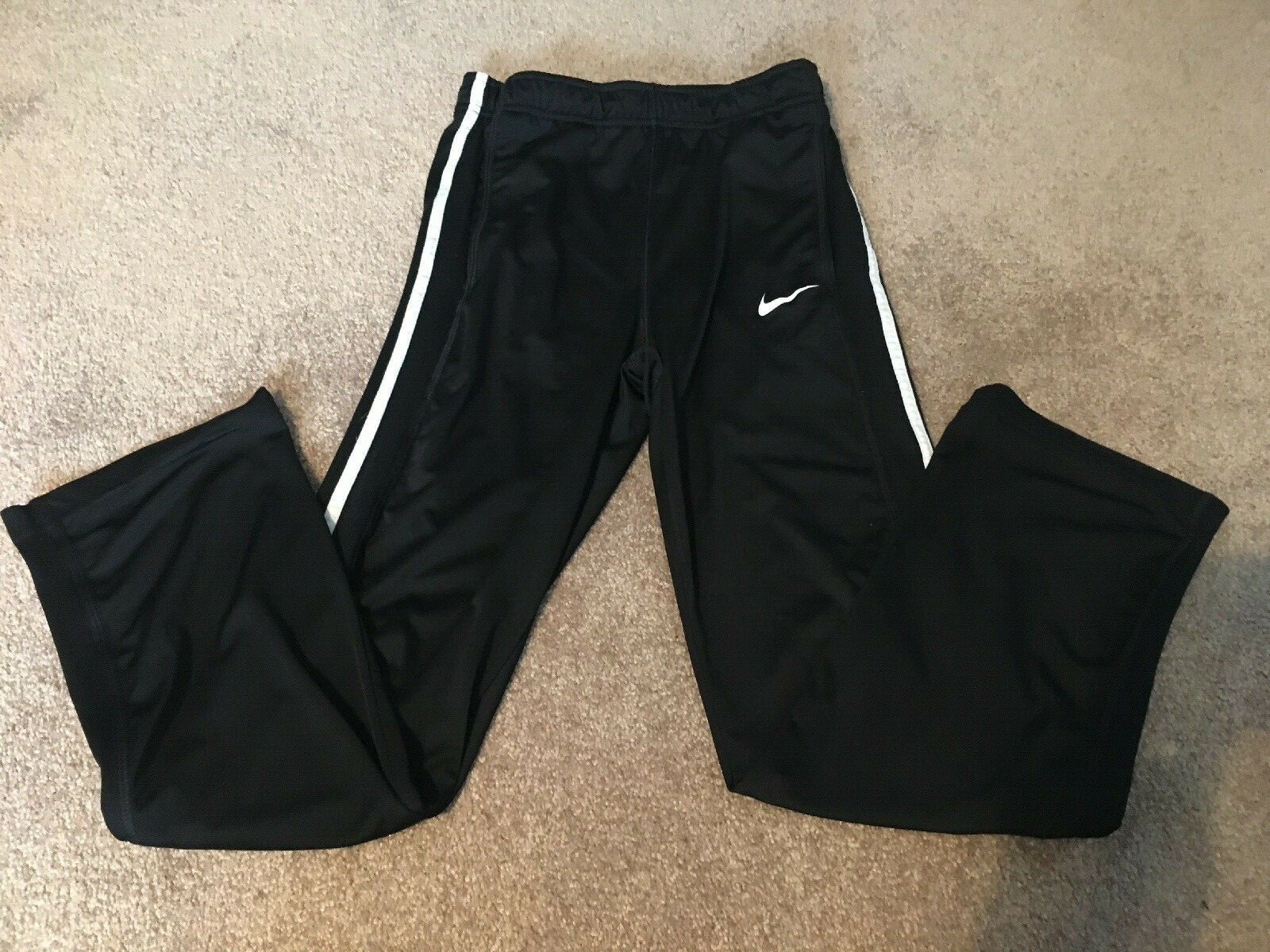 Black nike joggers with white stripe hotsell