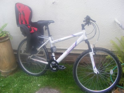 APOLLO ELUSION BIKE FITTED WITH A REAR CHILDS SEAT