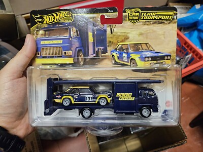 # 1/64 HOT WHEELS TEAM TRANSPORT #62 - OLIO FIAT 131 ABARTH + SECOND STORY LORRY