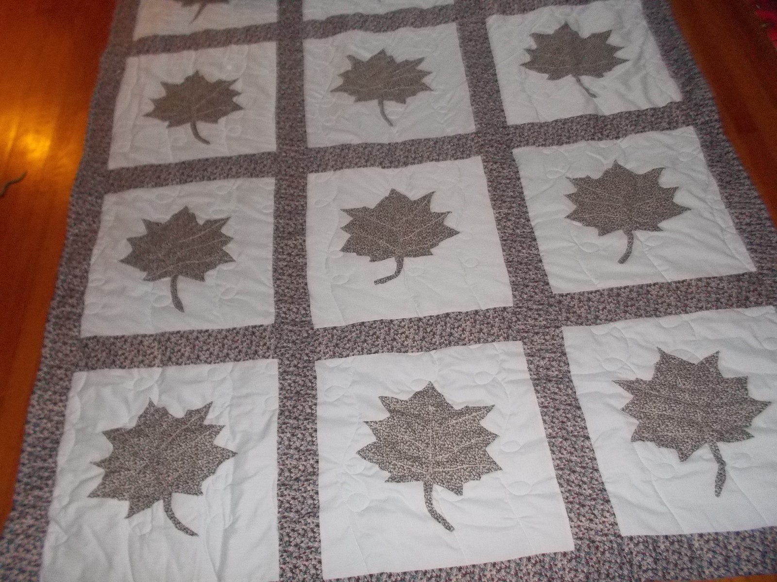 HAND MADE APPLIQUED QUILT-NEW -LEAF PATTERN. MACHINE QUILTED, TWELVE BLOCK BLUE