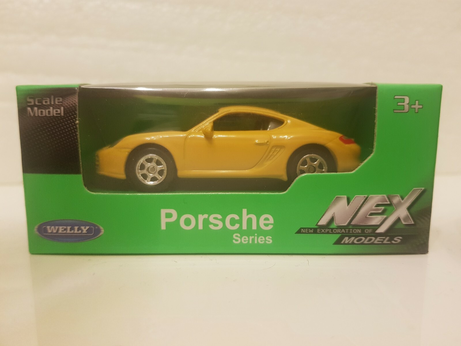 Welly NEX porsche cayman s yellow -1:60 1/60 diecast Scale