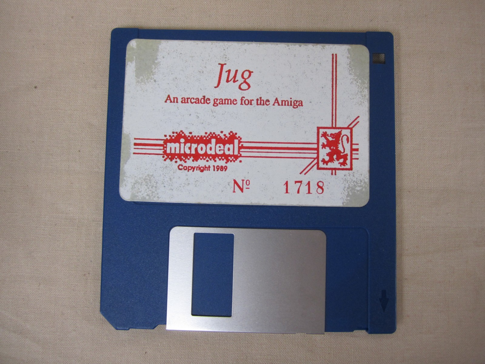 Vintage~JUG - An Arcade Game for the Amiga (Commodore Amiga, 1989)Disk/Manual