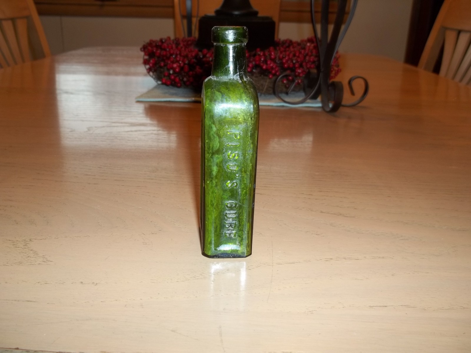 Antique green Piso's Cure Hazeltine & Co. bottle
