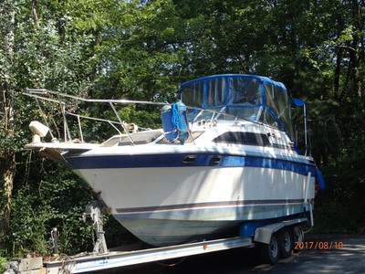Bayliner Ceria Sunbridge 2755 Cruiser with " triple" axel trailer