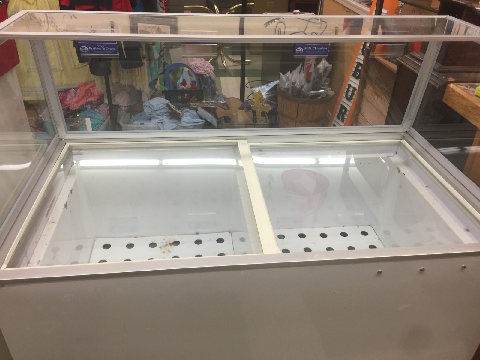 Ice Cream Machine, holds 8-1 gallon tubs, has sneeze guard and sliding glass
