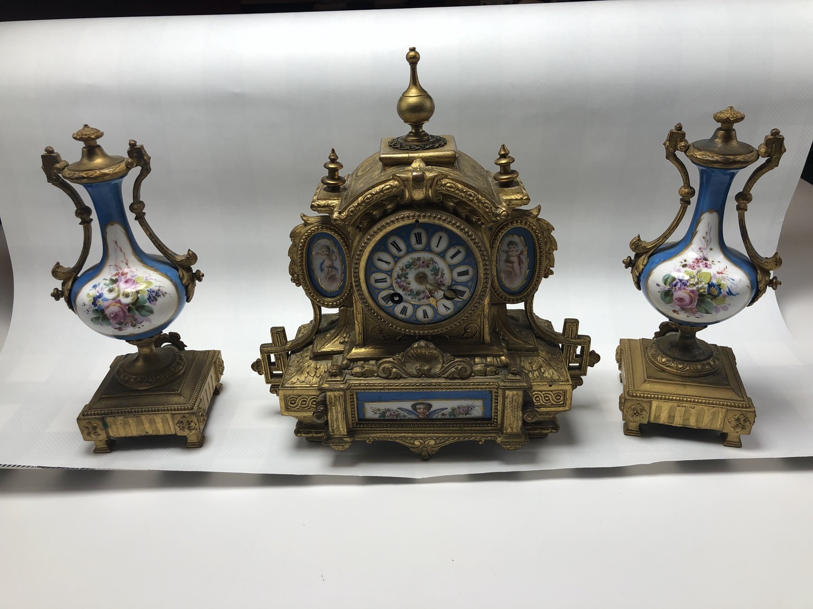 PH MOUREY LOUIS XVI REVIVAL PORCELAIN MOUNTED GILT METAL MANTLE CLOCK URN SET