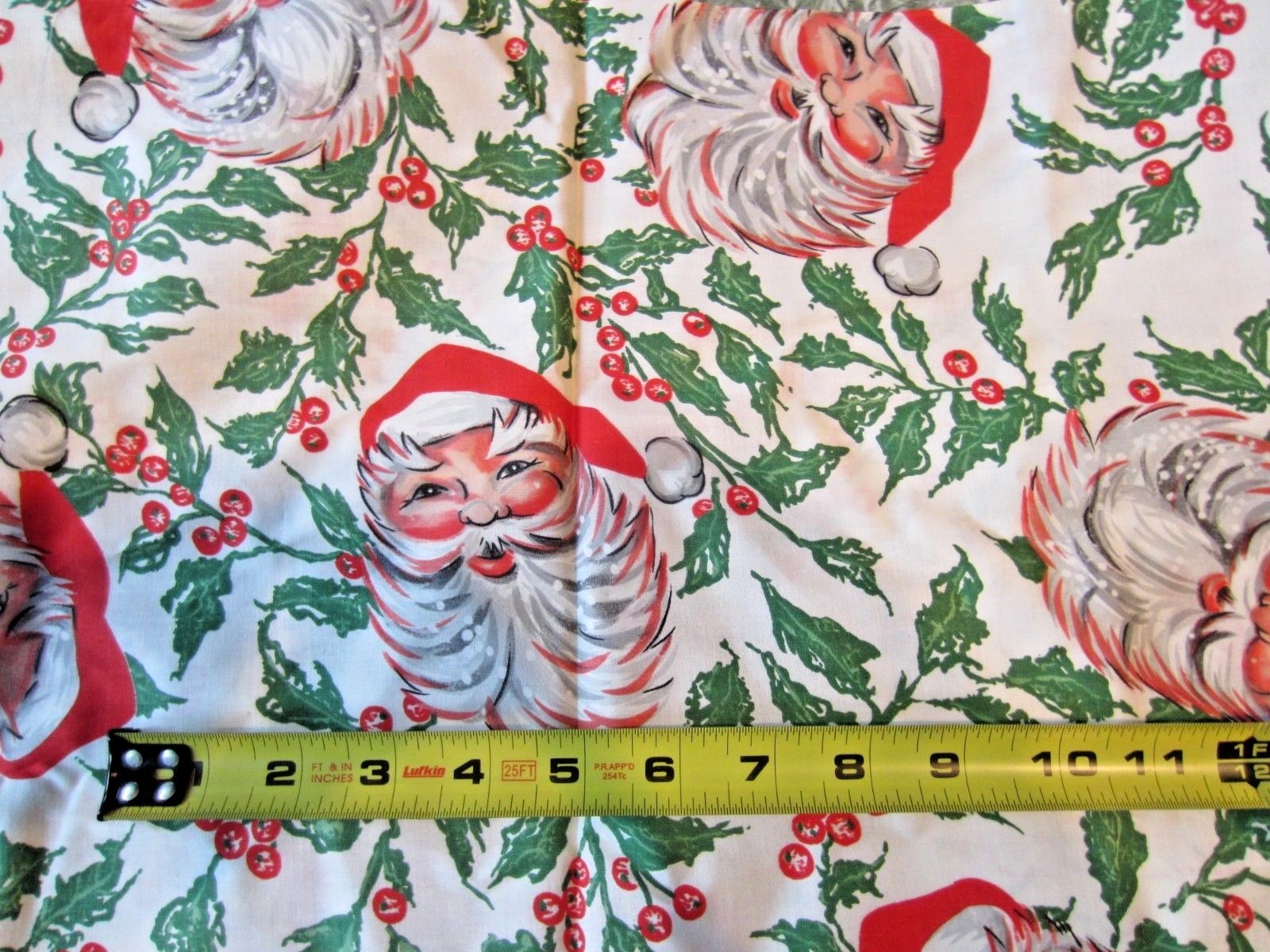 Vtg Santa Heads & Holly Novelty fabric 35