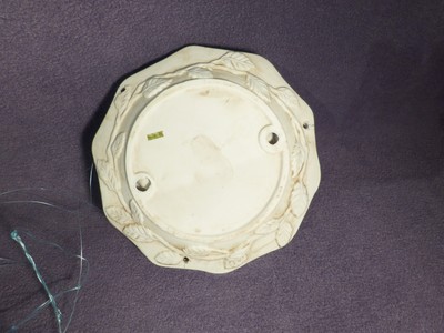 Hanging ceramic dish with cherubs, 8 1/2
