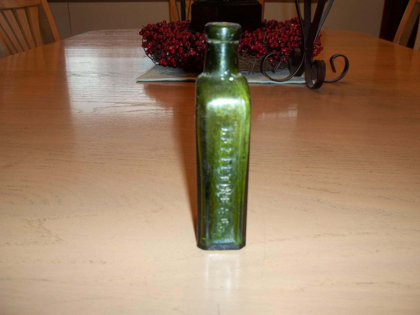 Antique green Piso's Cure Hazeltine & Co. bottle