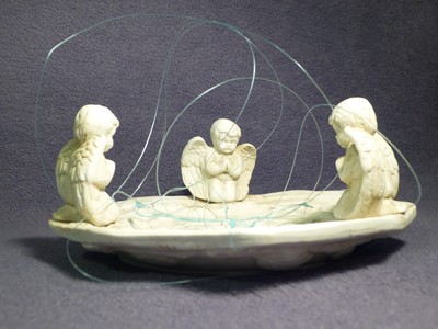 Hanging ceramic dish with cherubs, 8 1/2