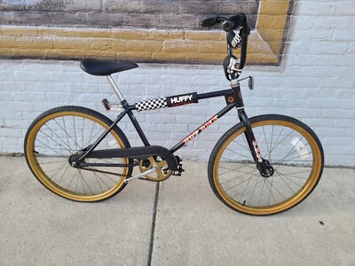 black and gold huffy bike