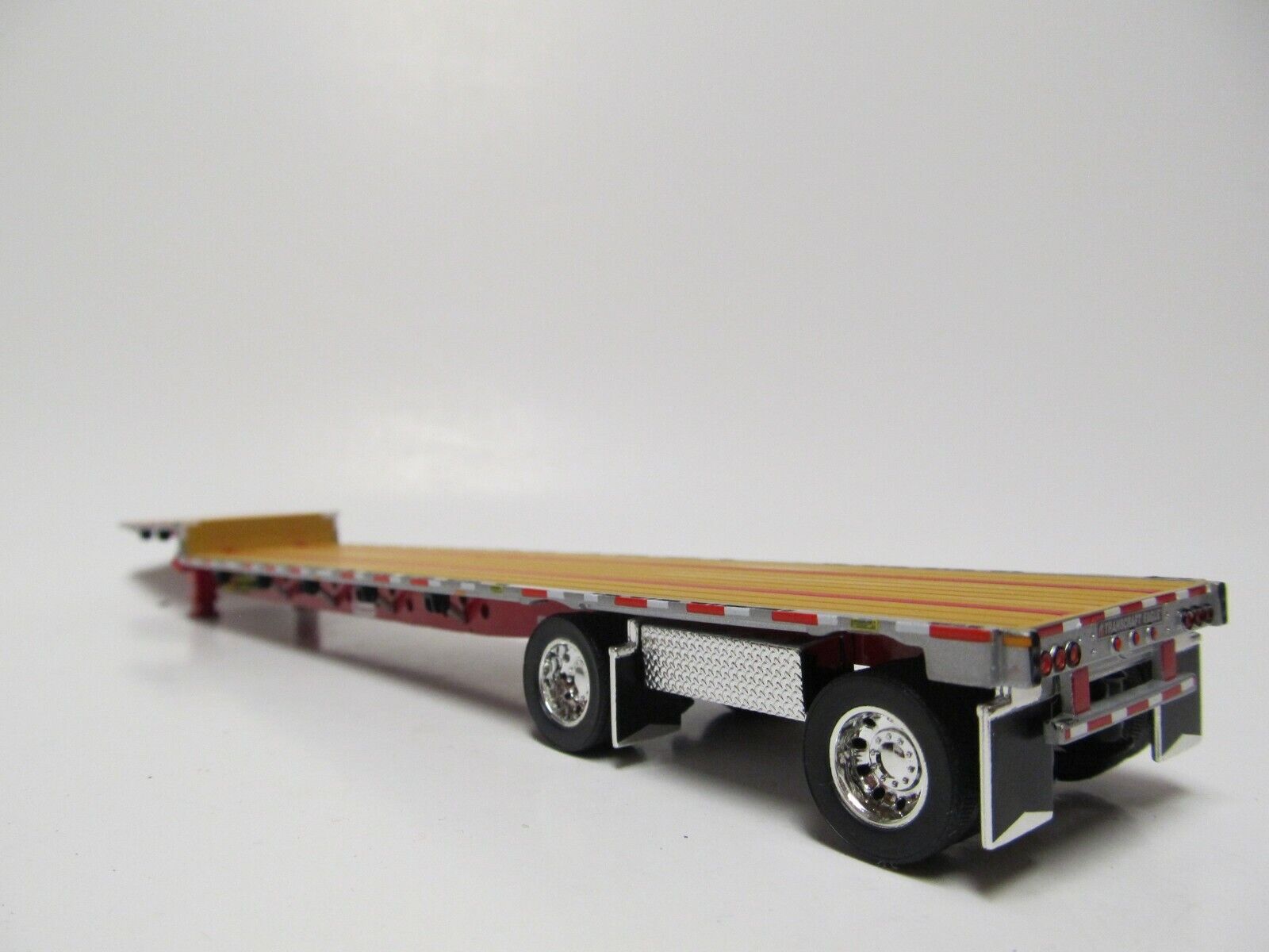 DCP 1/64 SCALE TRANSCRAFT STEP DECK TRAILER TAN / BROWN DECK WITH RED FRAME 1