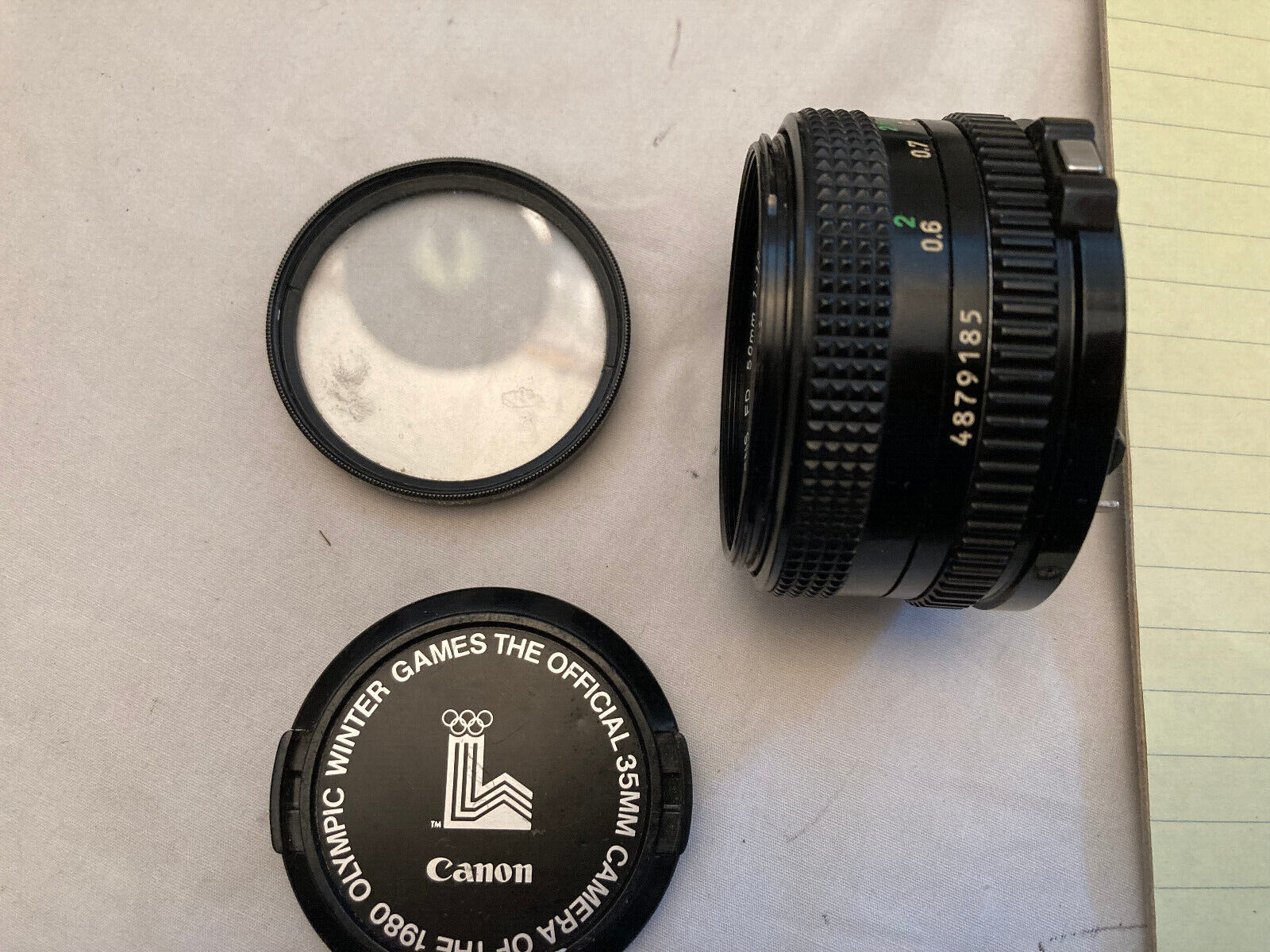 Canon Lens FD 50mm 1:1.8 lens cover and 52mm skylight filter Canon Lens FD 50mm 1:1.8 lens cover and 52mm skylight filter