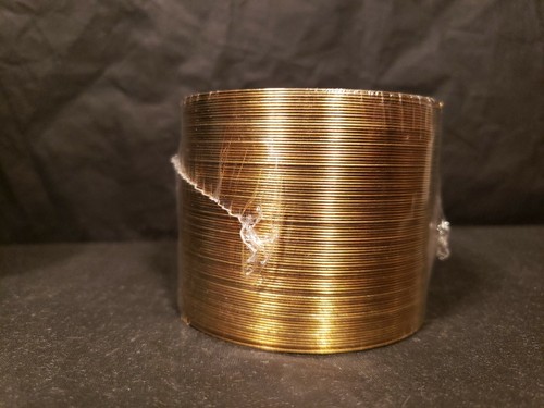 Vintage sealed nib Gold/brass anniversary Slinky Toy in Felt Box.