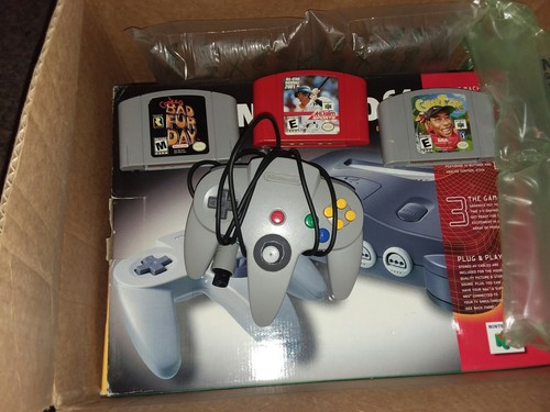 Nintendo 64 Console In Box with 2, oringal Controllers, and 3 games..