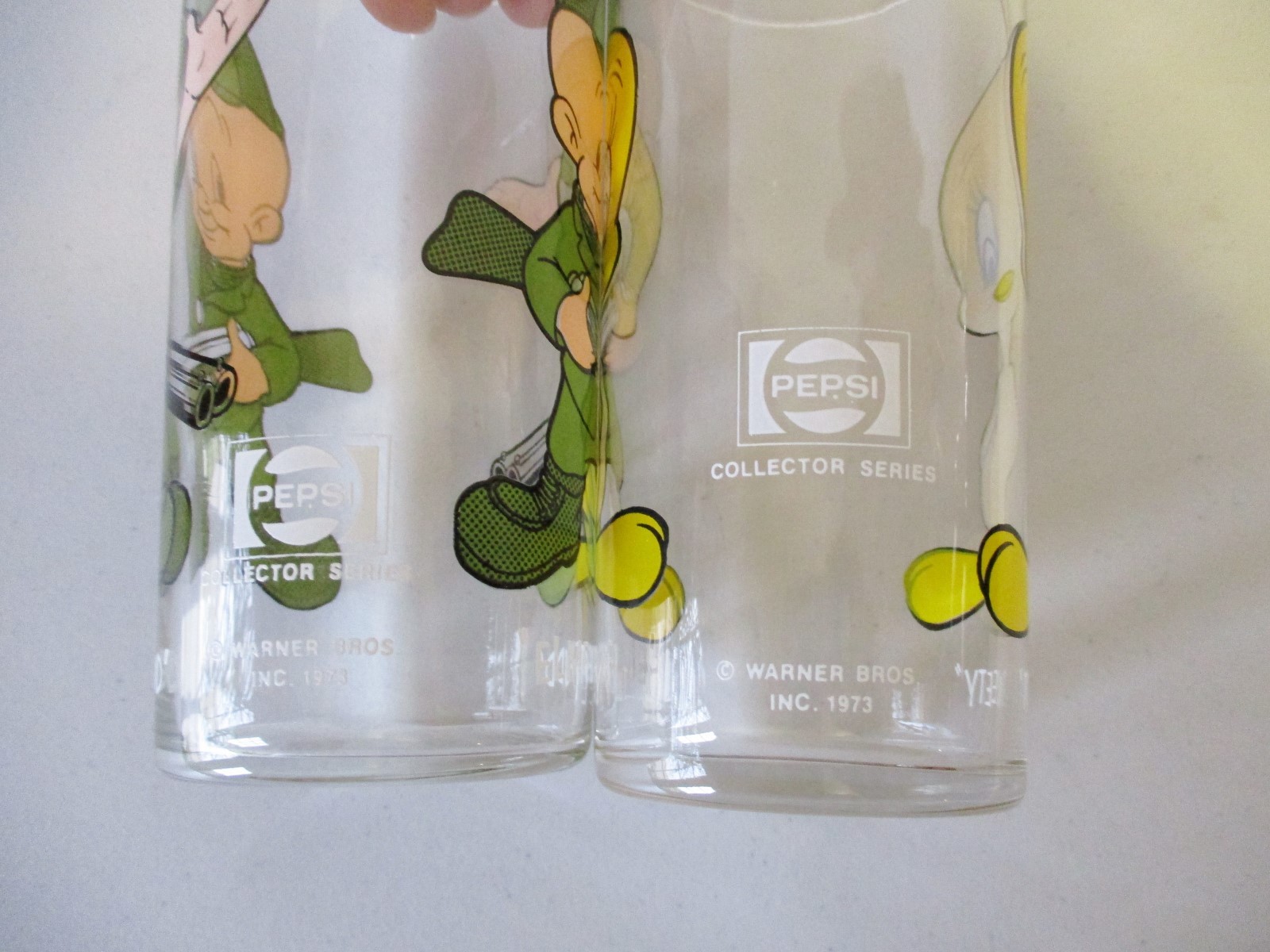 2- 1973 Pepsi Warner Bros Glasses-Elmer Fudd & Tweety Bird, Thin Glass