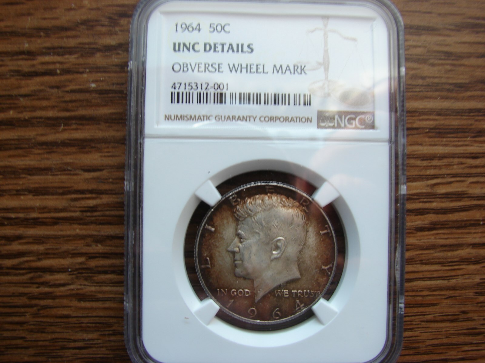 1964-D 90% KENNEDY 50C COIN NGC UNC.DETAILS OBV..WHEEL MARKS TONED MAKE OFFER!!!