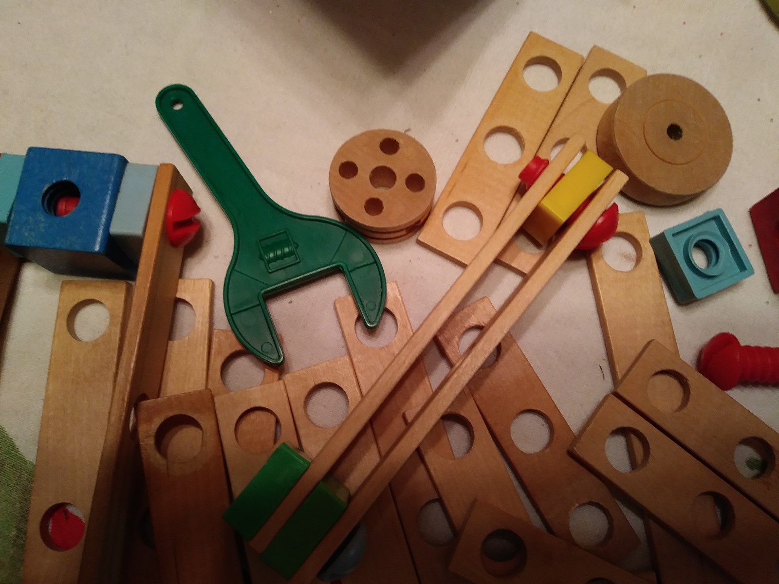 Wooden Erector Set with Plastic Nuts and Bolts, no box or container.