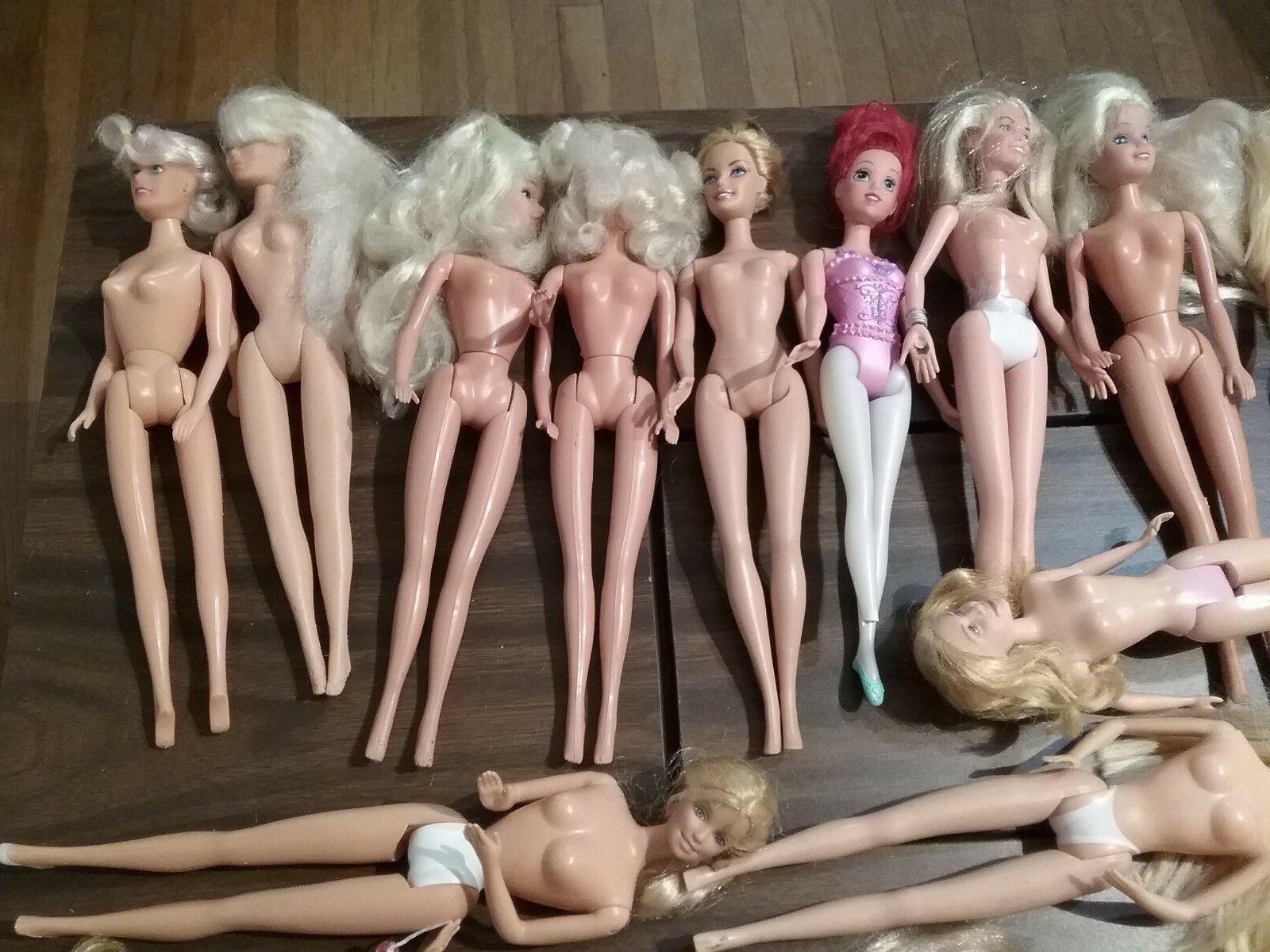 Lot of 25 fashion model dolls some BARBIE  damaged need repair or for parts