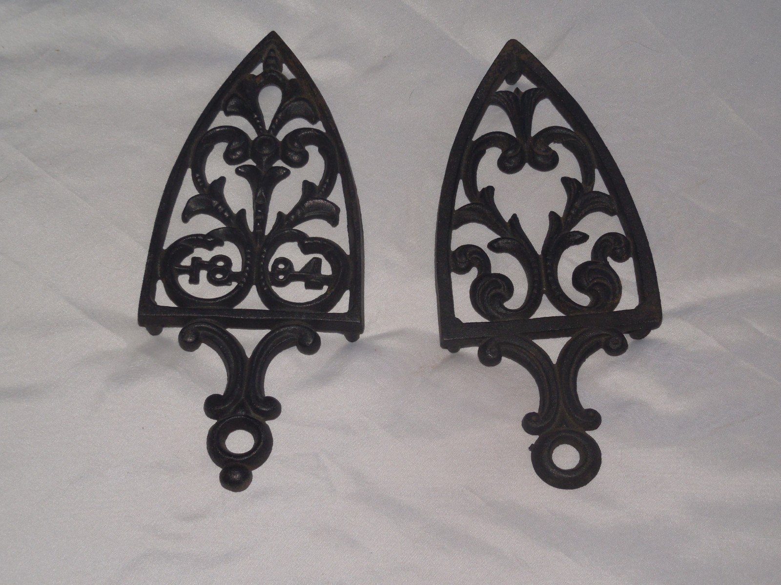 TWO PRE-OWNED BLACK CAST IRON  KITCHEN TRIVETS