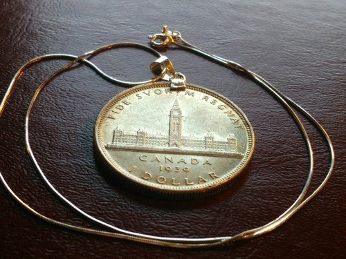 1939 Canada Parliament Silver Dollar on an 18