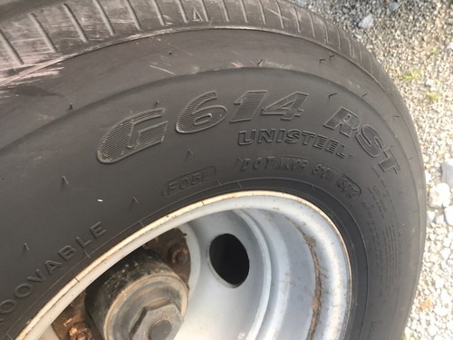 2008 Big Tex Black 3 Car Hauler Tandem Used Trailer with dual rear wheels.