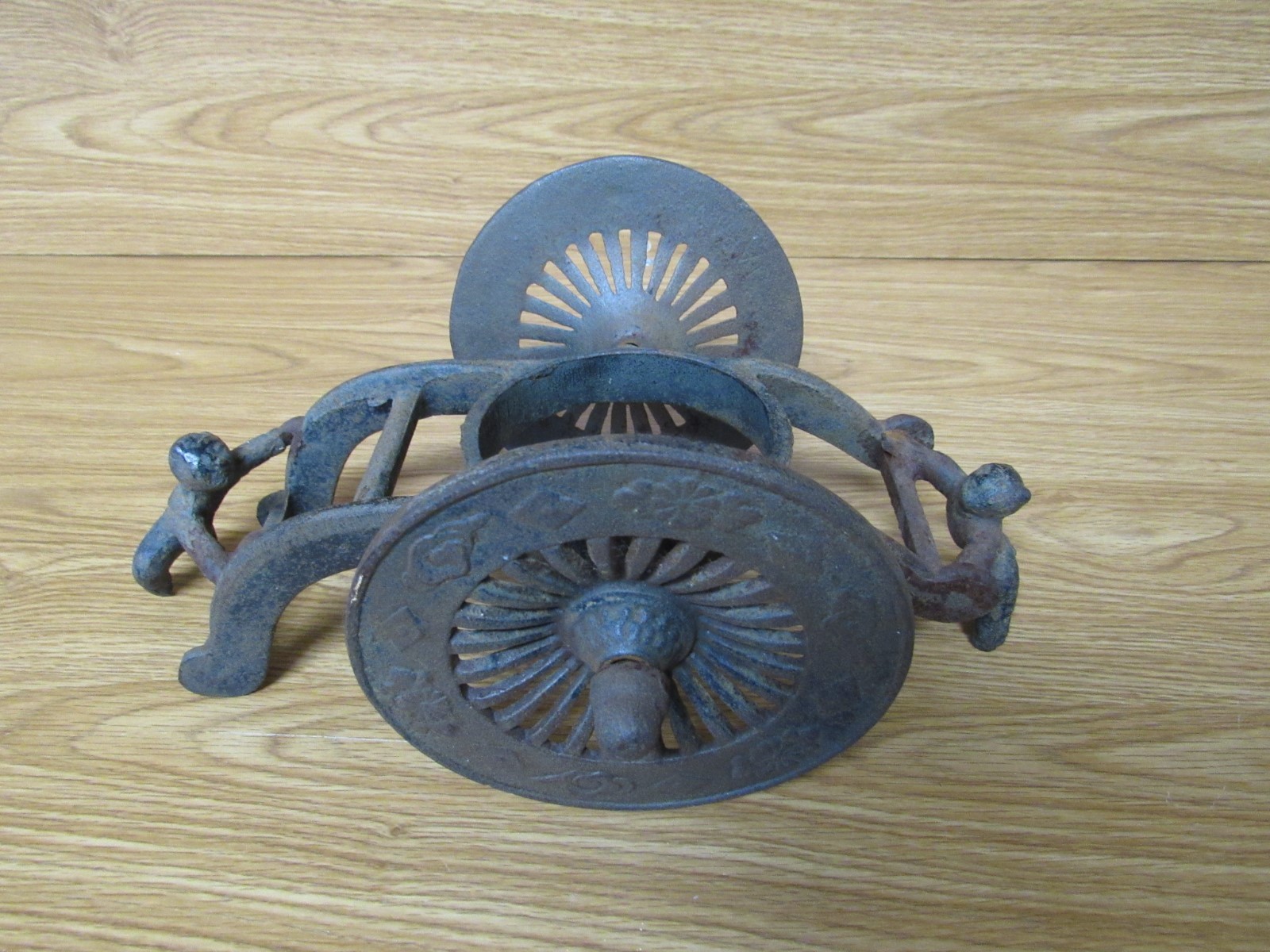 Antique Vintage Cast Iron Primitive-Two Men Pushing Wheels