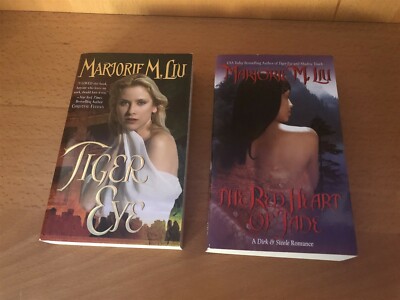 2 PAPERBACK BOOKS BY MARJORIE M, LIU TIGER EYE & THE RED HEART OF JADE