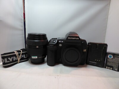 Olympus EVOLT E-3 10.1MP with the Olympus 18-180mm zoom lens Looks & works great