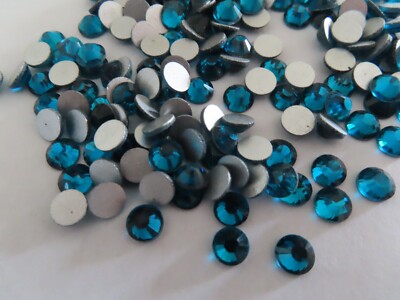 100 Swarovski Flatbacks 30ss Blue Zircon/foiled. #2028