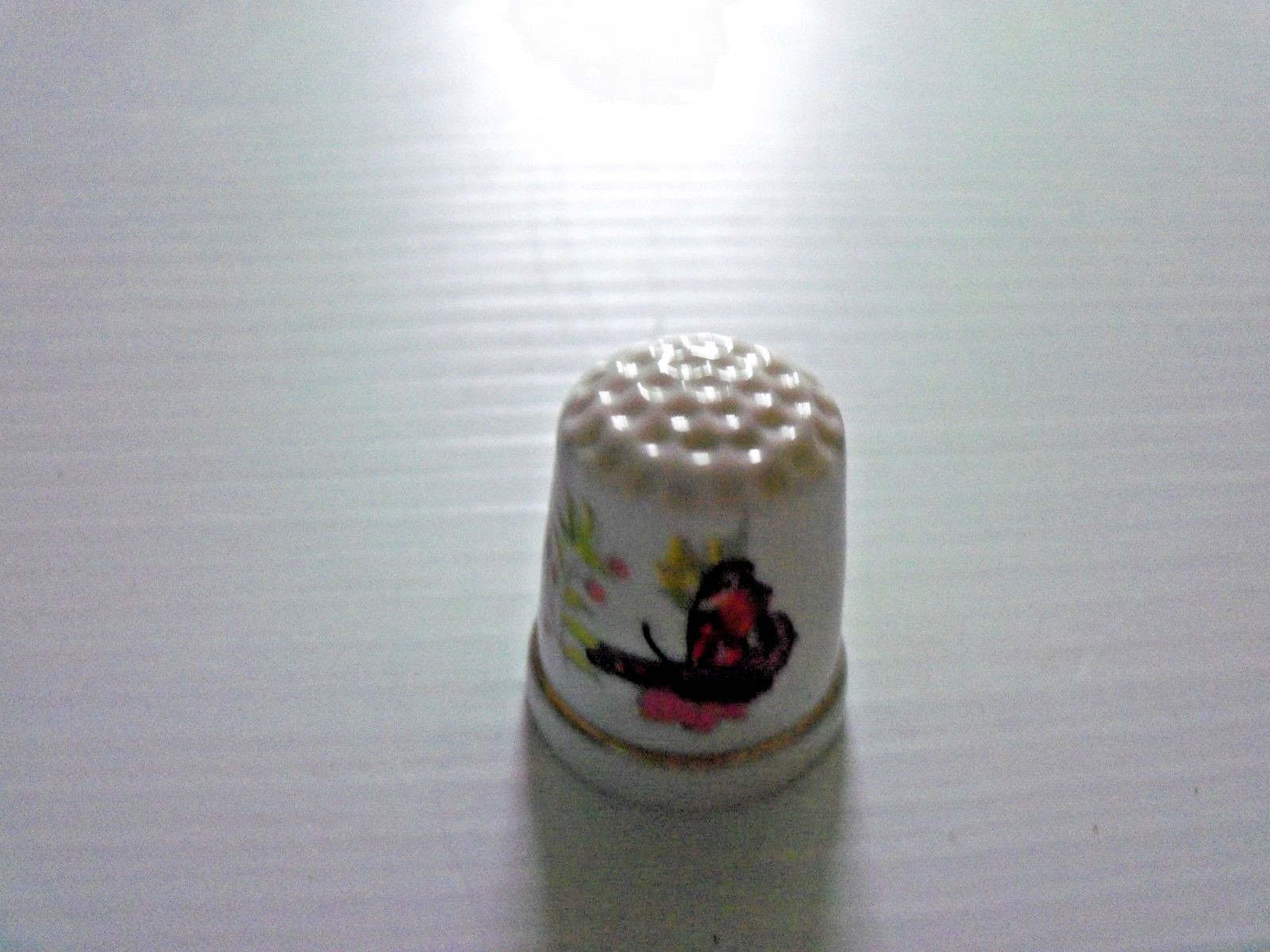 Lot of 7 Porcelain Thimble with Butterfly Pictured On It
