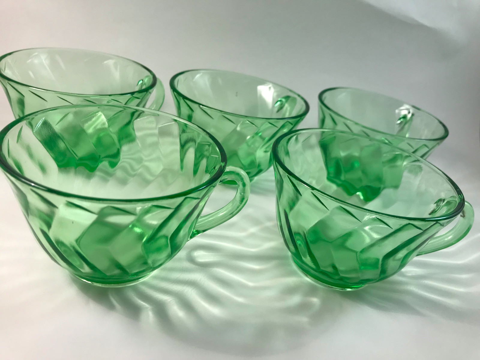 5 green vaseline glass teacups with saucers and one extra saucer VINTAGE