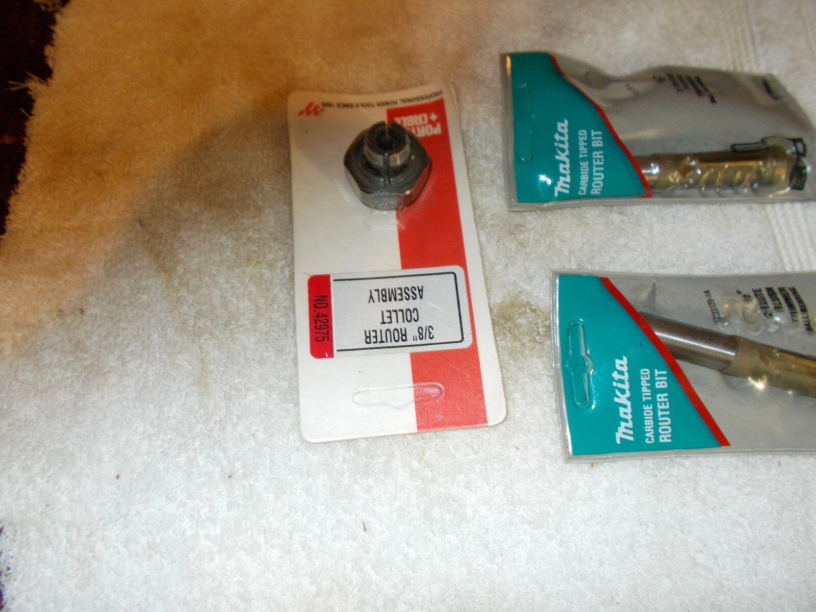 2 makita router bits and 1 pc collet