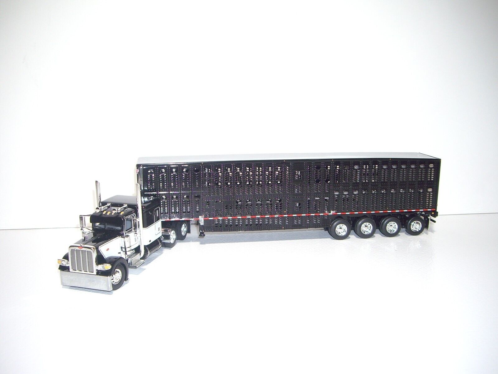 DCP FIRST GEAR 1/64 PETERBILT 389 WITH 63'' SLEEPER AND 4 DCP FIRST GEAR 1/64 PETERBILT 389 WITH 63'' SLEEPER AND 4