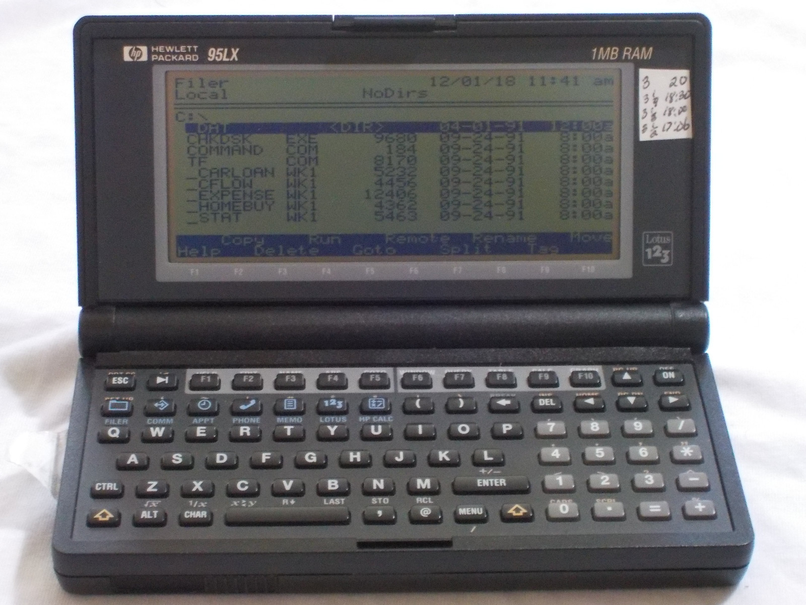 Hewlett Packard HP 95LX 1MB, with 1MB PCMCIA SRAM card, AC adapter, and manuals