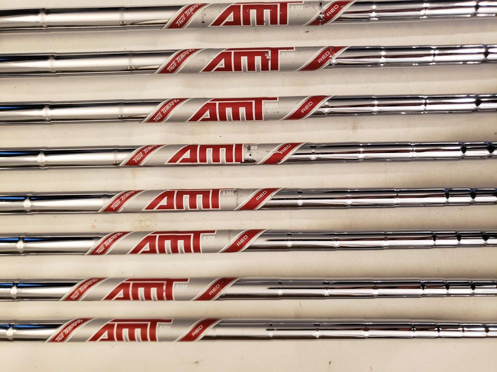 Used Titleist T300 Iron Set (4-PW, GW) 8 Irons - Stock AMT Red R300 - Reg - RH