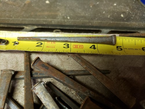 63 Antique 3 1/2 inch, square cut nails hand made unused, straight but rusty.