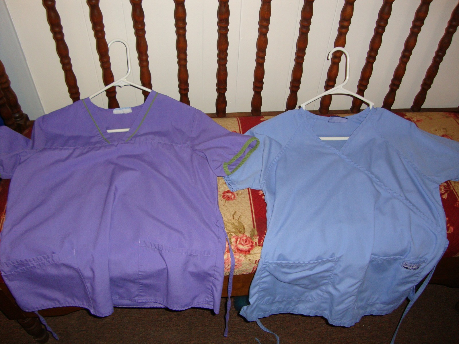 23 women's scrubs tops.  Mostly medium, some small, gently used.