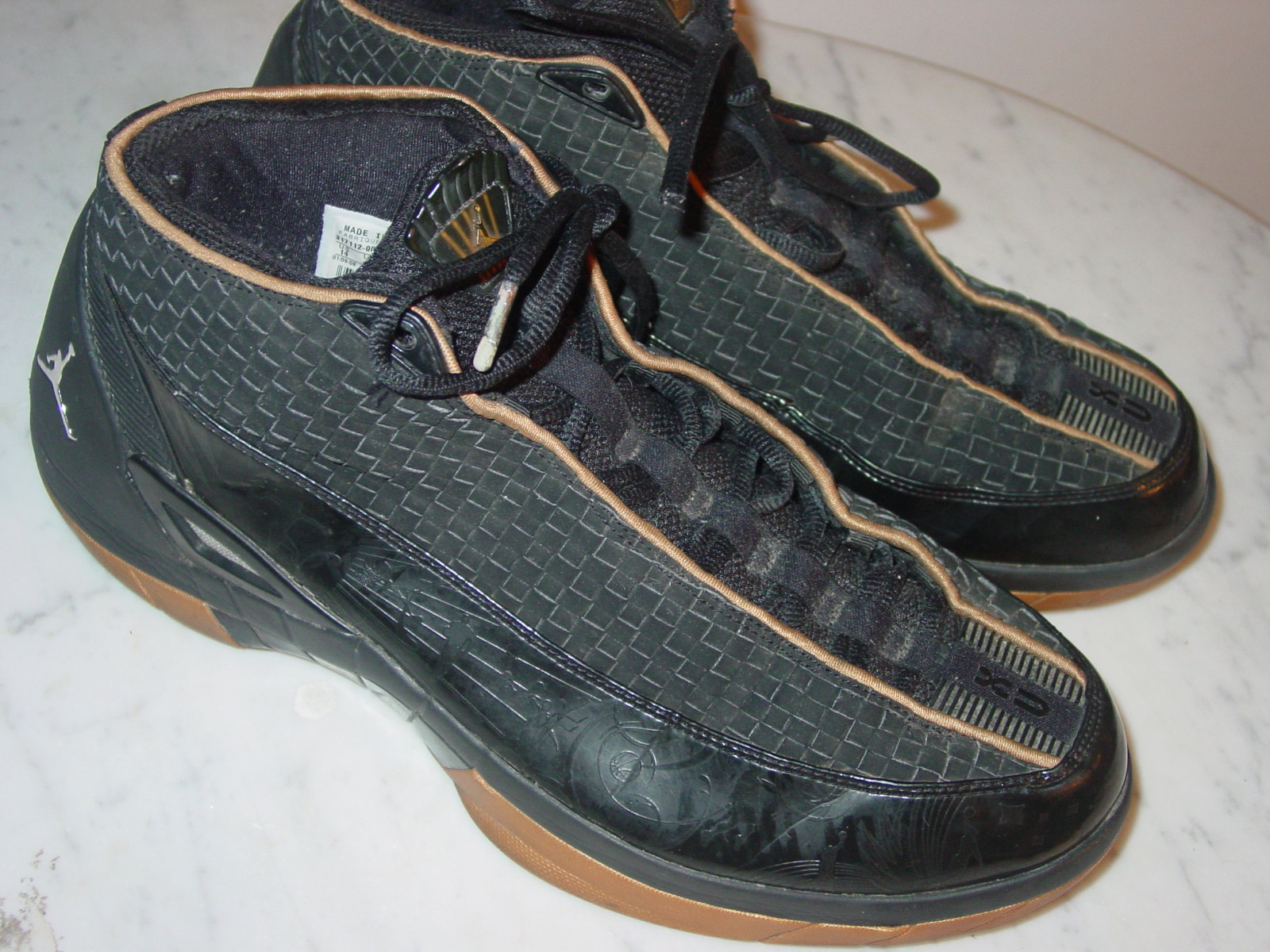 black and gold jordan 15s