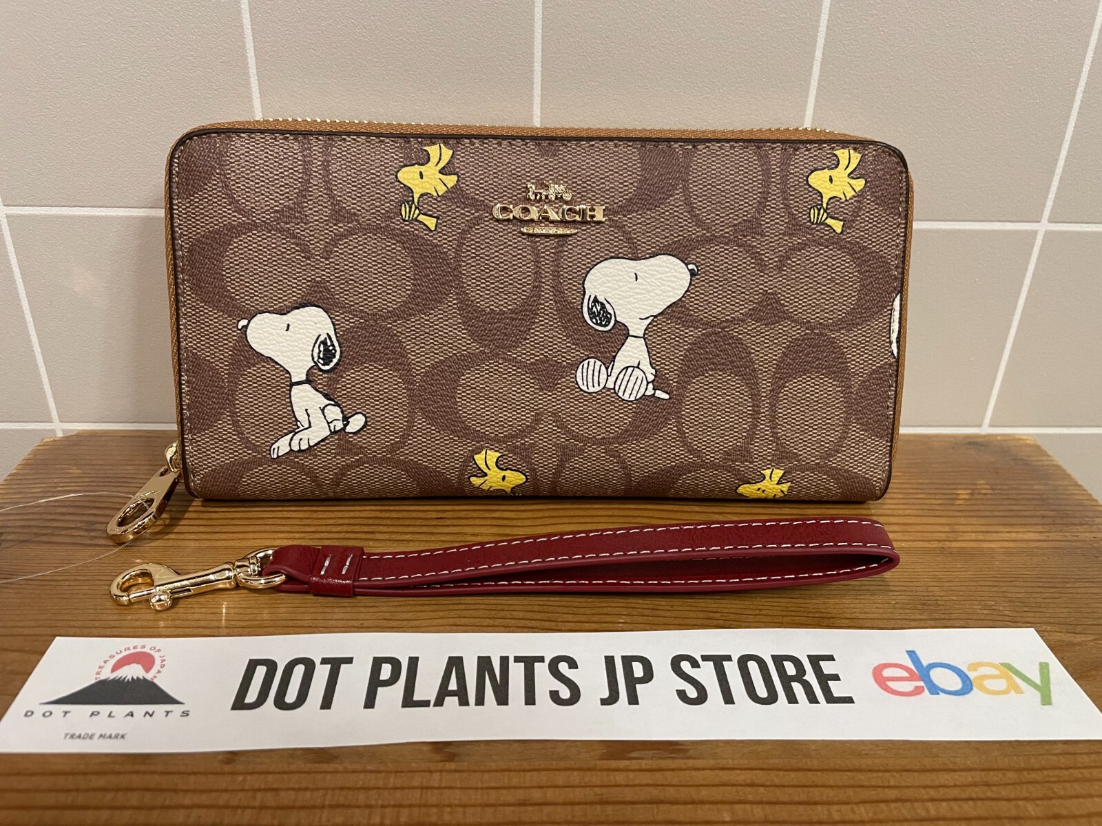 【COACH】【COACH X PEANUTS】 ウォレット・ニュースペーパー Coach X Peanuts Essential Billfold Wallet With Newspaper Print