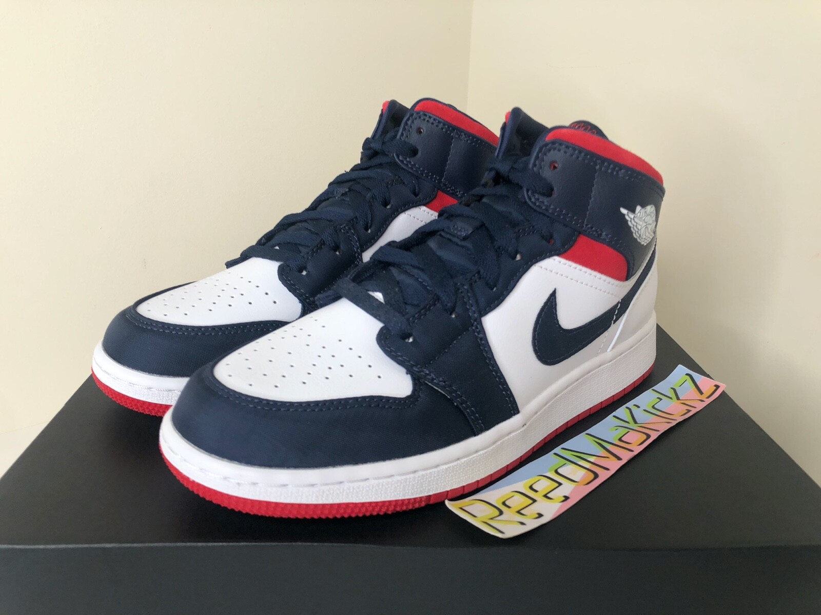 red white and blue jordan 1 grade school