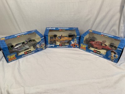 DISNEY LOT OF 3 WOODYGOOFY BUZZ BURAGO DIECAST FORMULA RACING CAR 1/24 SCALE