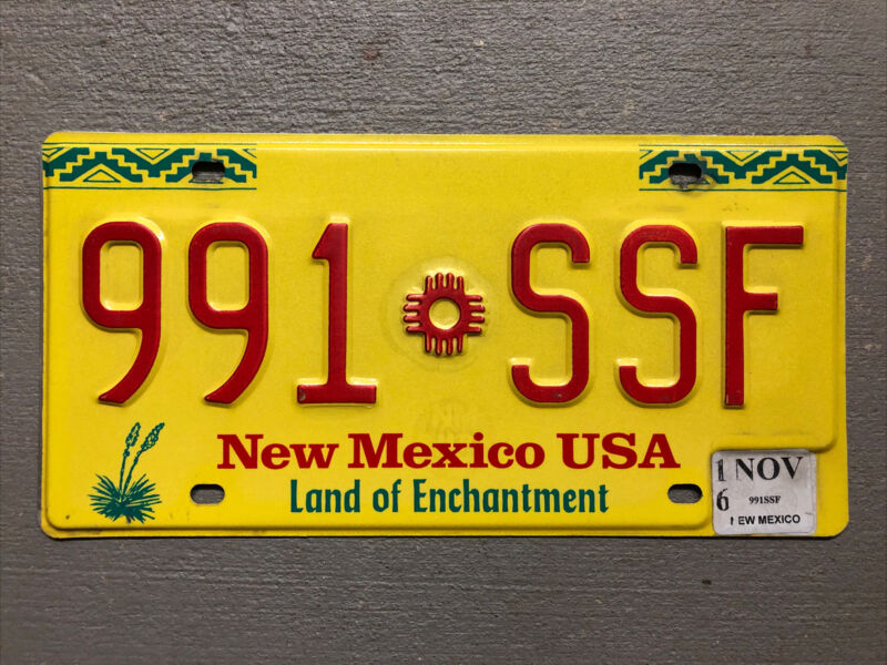 NEW MEXICO LICENSE PLATE LAND OF ENCHANTMENT YELLOW ZIA RANDOM LETTERS/NUMBERS