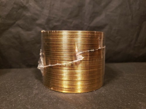 Vintage sealed nib Gold/brass anniversary Slinky Toy in Felt Box.