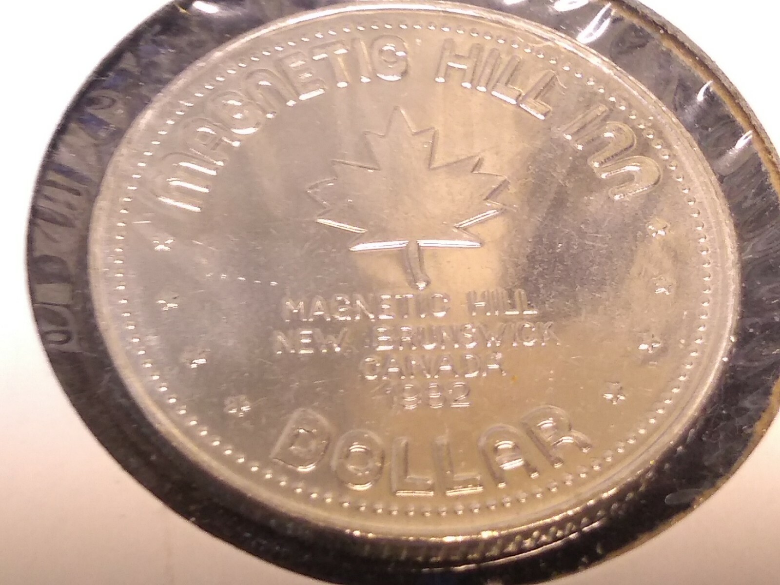 1982 Magnetic hill New Brunswick Canada $1 Trade token