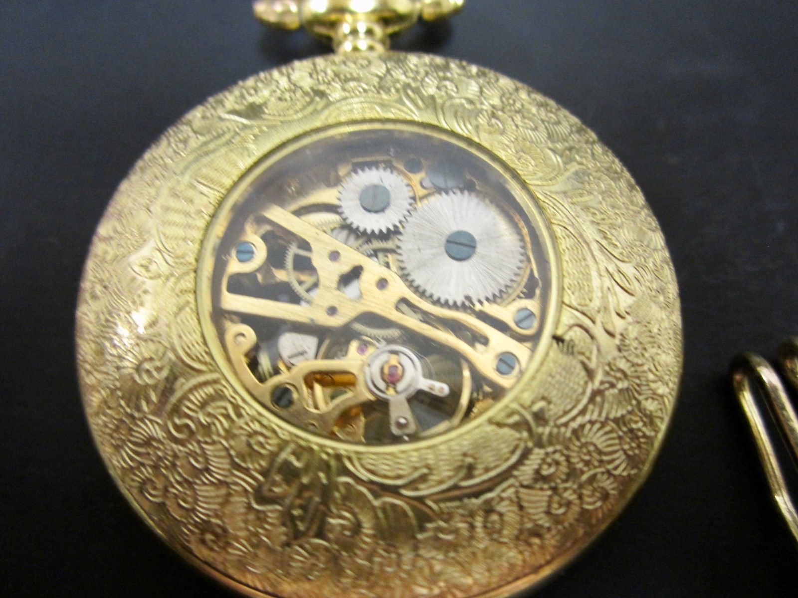 beautiful wind up pocket watch with cutouts brass? Gold filled? No brand